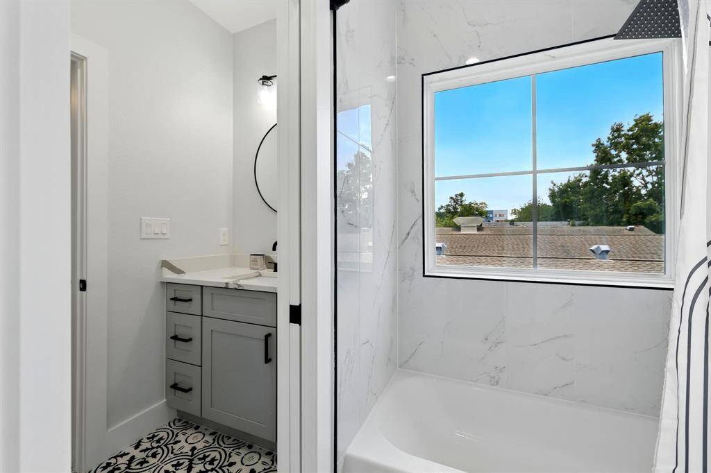 Separate sinks and your own vanity space. This second bathroom is a tub and shower combo.