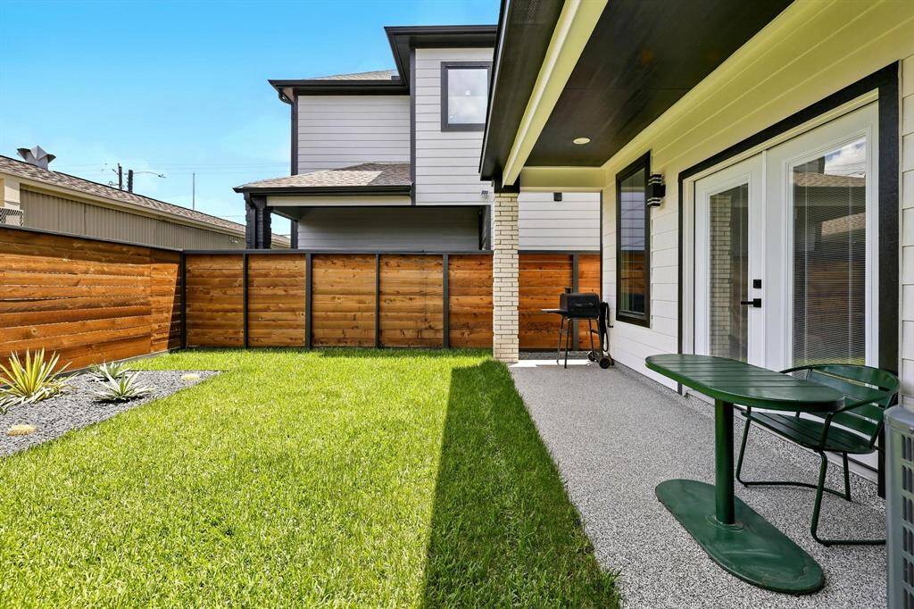 Covered sitting area provides the ideal spot for relaxing or entertaining, while the open layout leaves room for a garden bed, outdoor kitchen, or play area .