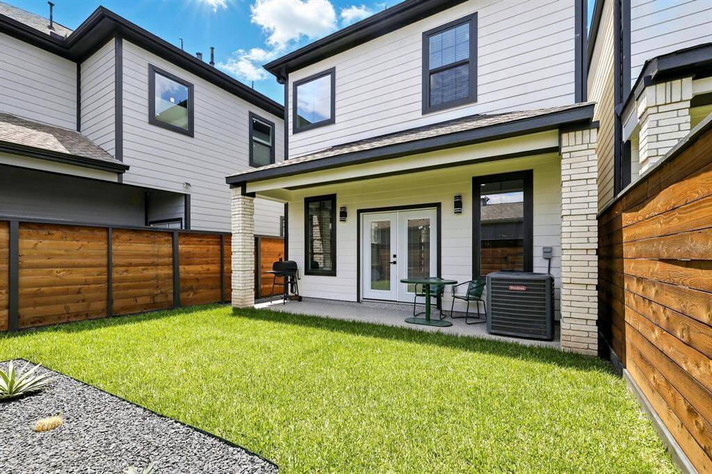 This streamlined backyard compliments the home's contemporary design and is perfect for those who appreciate style with simplicity.