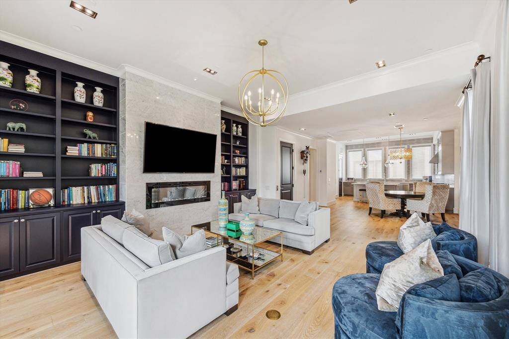 Welcome to 5211 Calle Cordoba, located in the heart of Rice Military! With a spacious, open living space concept and an abundance of natural light, you will enjoy hosting or cozy nights in front of the beautiful electric fireplace.
