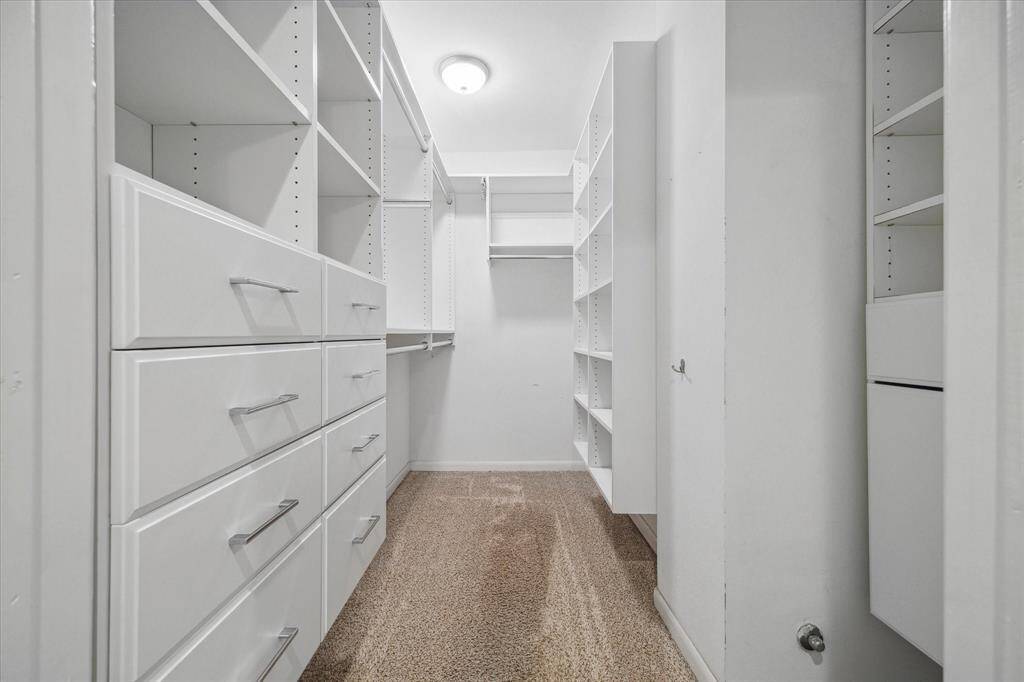 Generous primary closet.