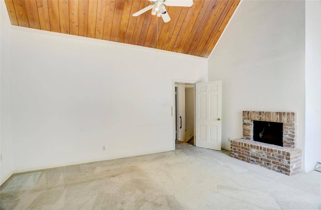 The primary bedroom has a wood burning fireplace.