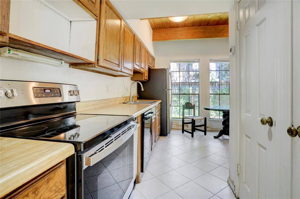 The 5x14 SF kitchen has refrigerator, stove and dishwasher.