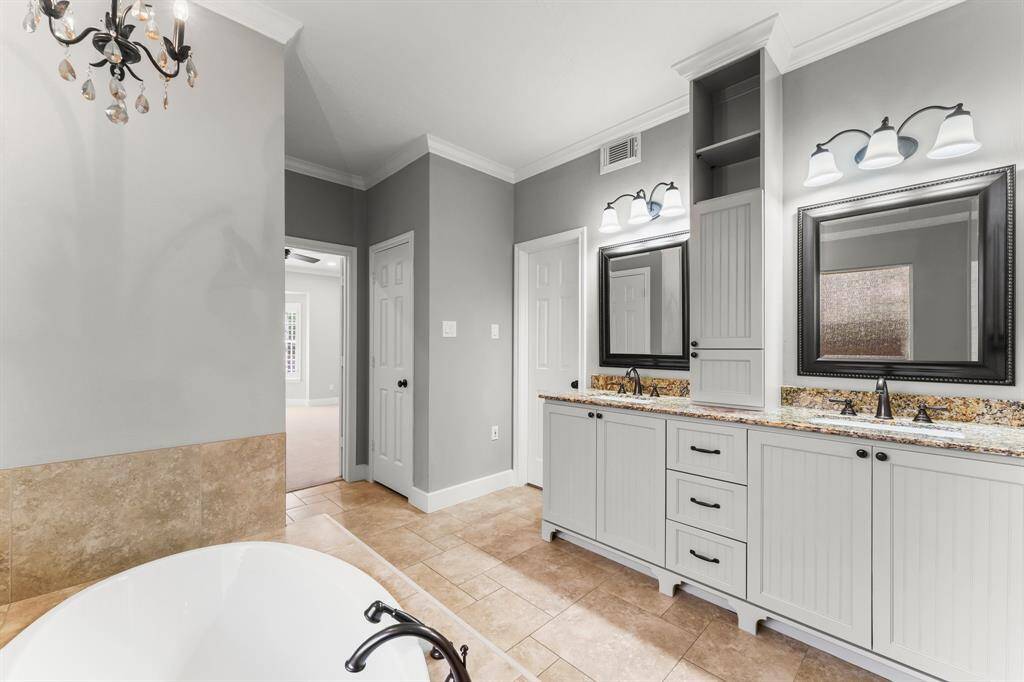 Primary Bathroom includes his and her closets!