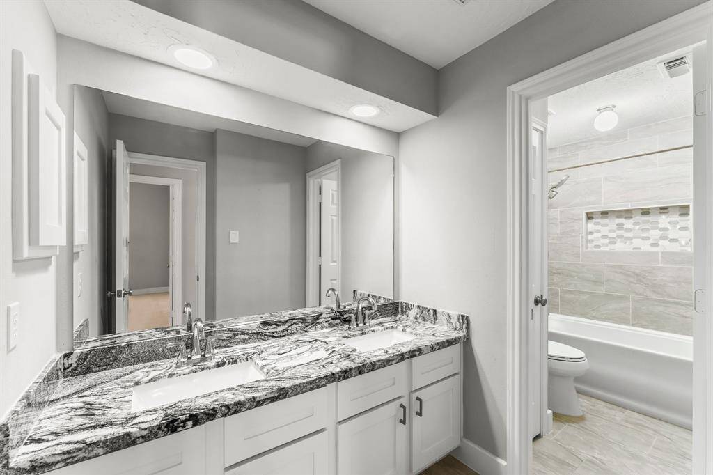 Thoughtfully designed upstairs secondary bathroom with oversized tub and sleek updates!