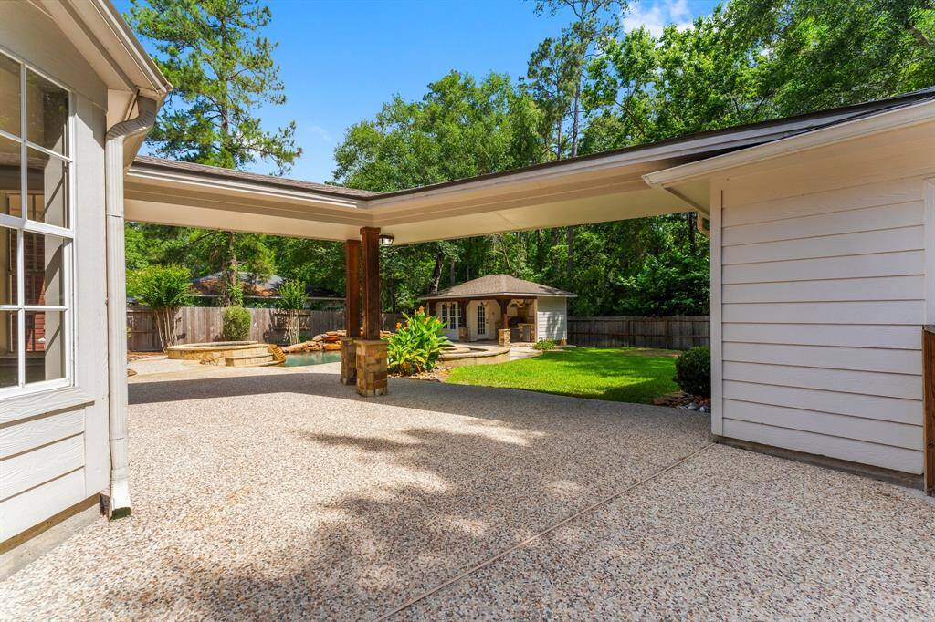 Covered breezeway and detached garage.