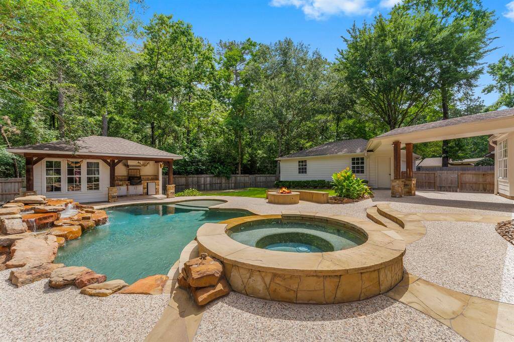 A serene backdrop of trees provides excellent privacy