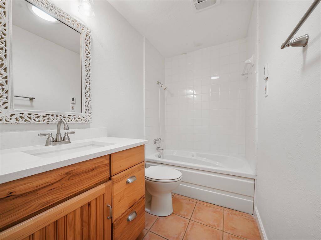 Remodeled secondary bathroom. Heated flooring with new tile and Vanity sink.