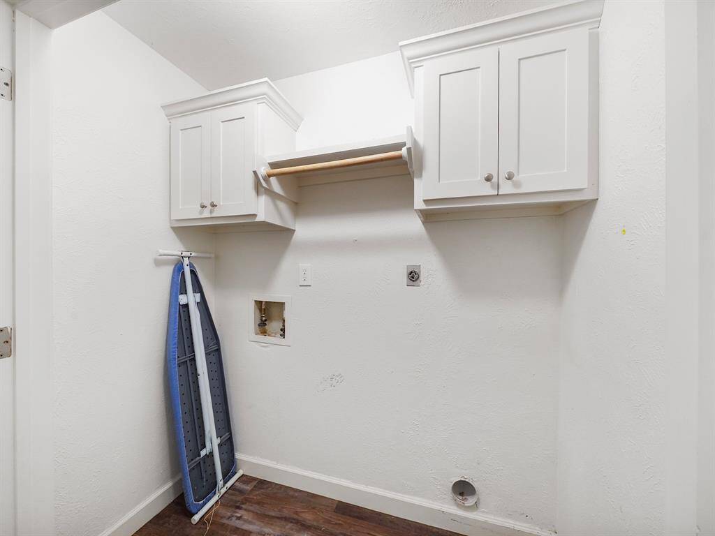 Laundry room with connections for washer and dryer.