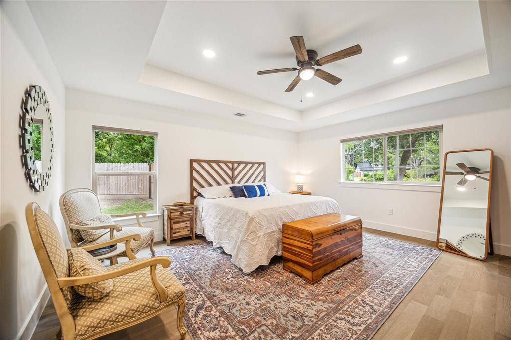 Clean, well-lit primary bedroom offering a serene and open atmosphere.