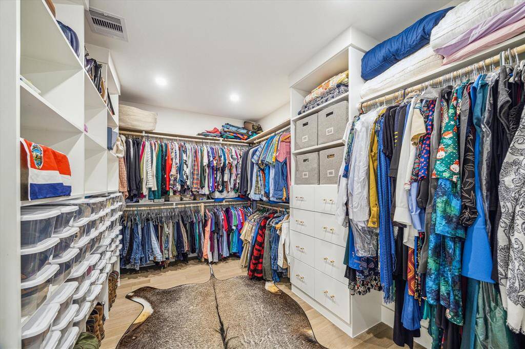 Generously sized walk-in closet offering plenty of space for organization.