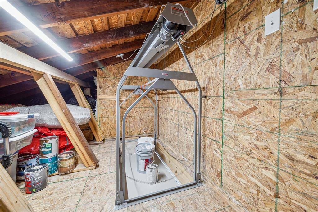 Convenient lift from garage to attic for easy transport of gear and storage items.