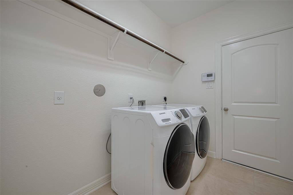 Large laundry room with ample storage.