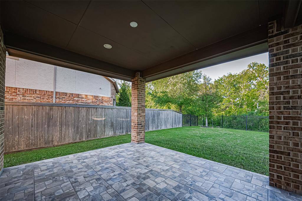 Enjoy the privacy of no rear neighbors, a spacious backyard, complete with outdoor lighting, a sprinkler system in the front and back, and rain gutters that enhance functionality.