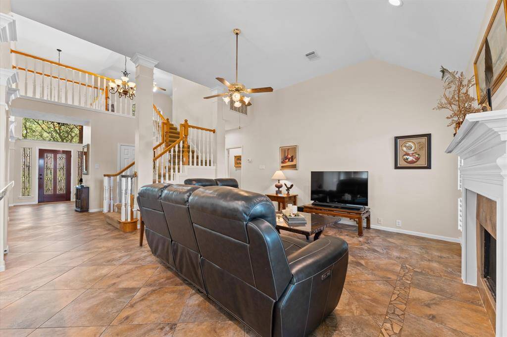 The family room has a large wall for your TV. The ceilling is very tall, lending to it's light and bright appeal.