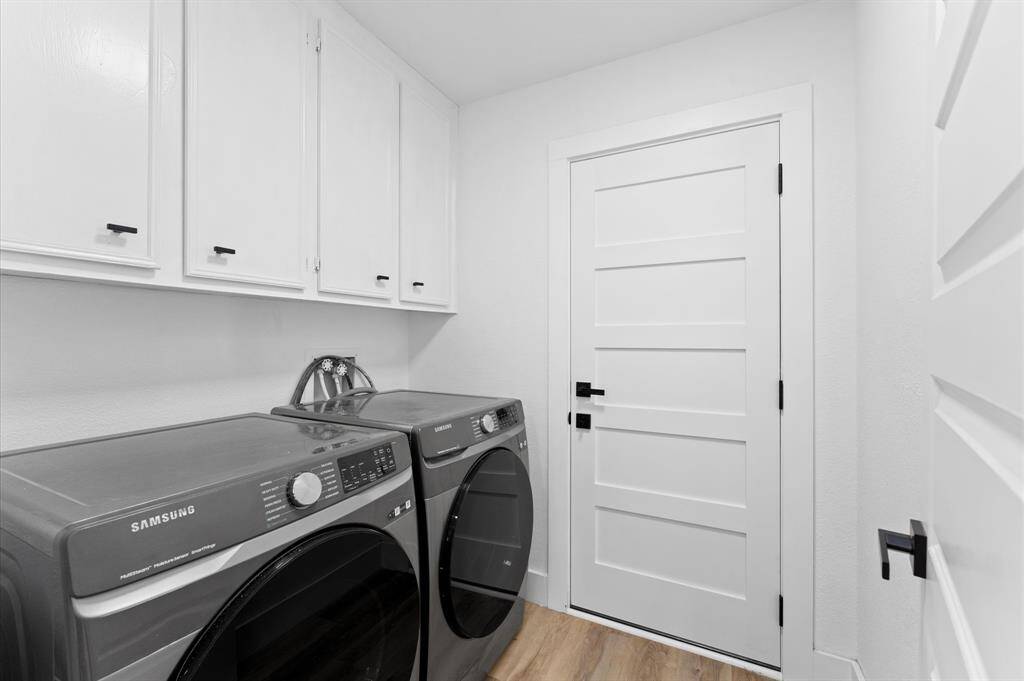 Dedicated laundry space with storage and washer/dryer included