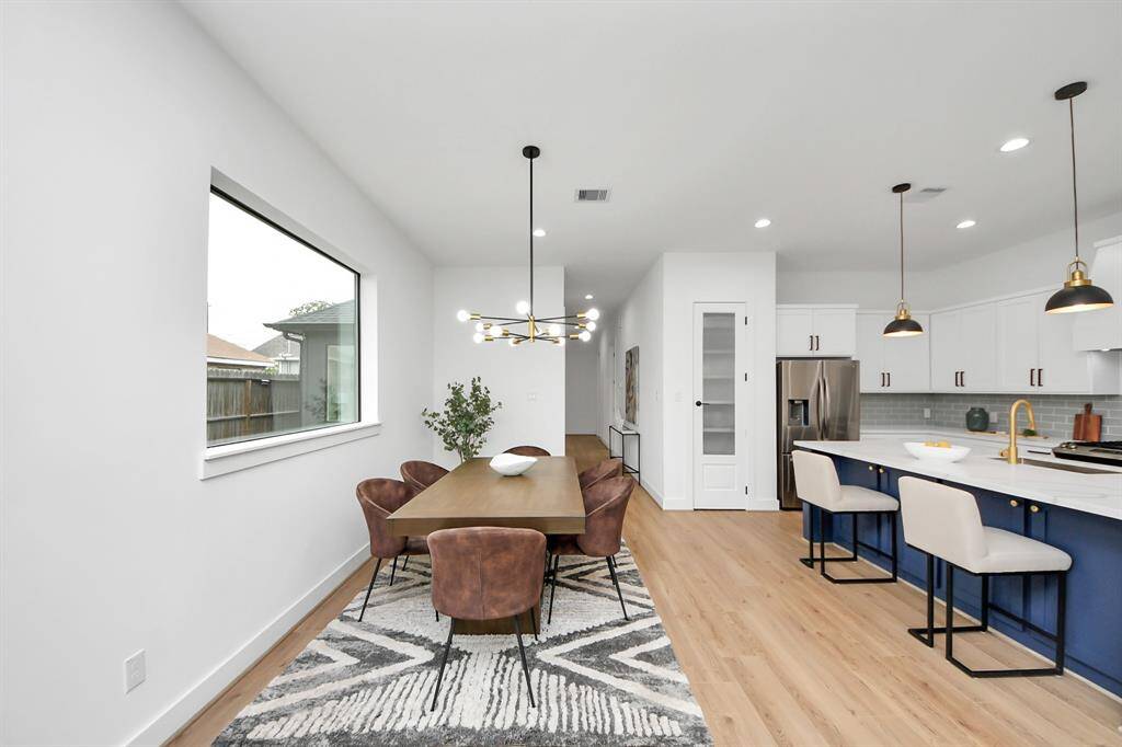 This thoughtfully designed homeseamlessly connects the kitchen withthe charming dining area.