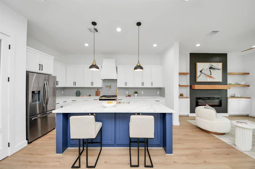 The kitchen, an integral part of thishome's open-concept design,seamlessly flows off the living room,creating a harmonious andconnected living space.