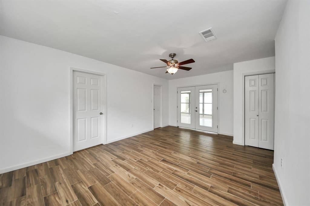 Primary bedroom with dual closets, offering plenty of storage space