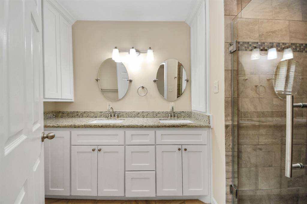Primary  bathroom has dual sinks with ample counter space