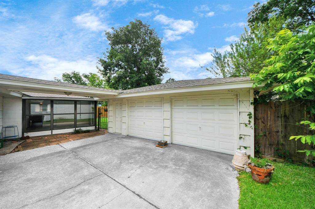 Features a spacious two-car garage and an extended driveway with plenty of room for additional parking