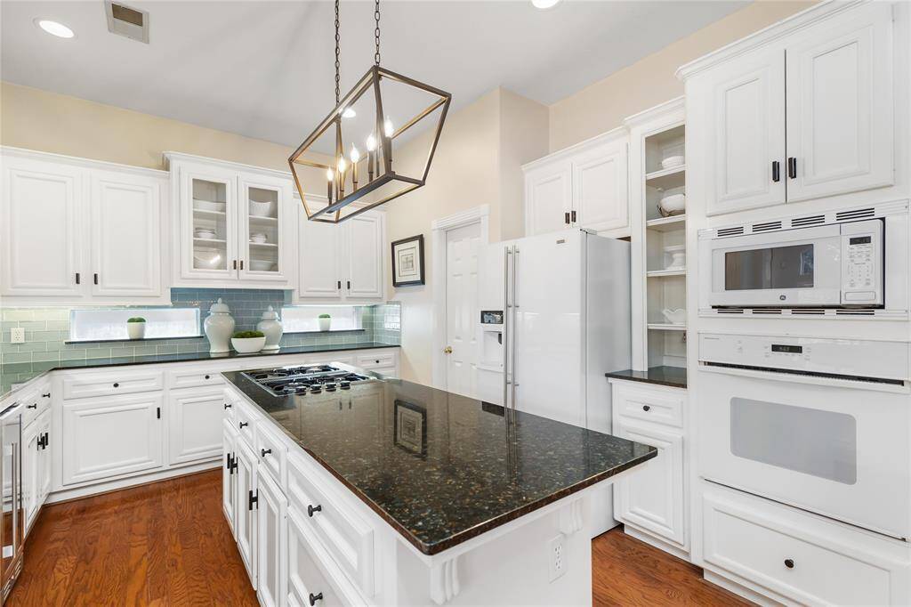You won't run out of cabinet space in this Kitchen!