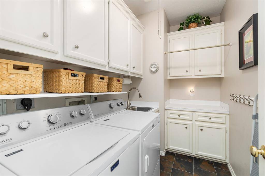 Enjoy the convenience of an in-home Utility Room, with extra storage and a utility sink.