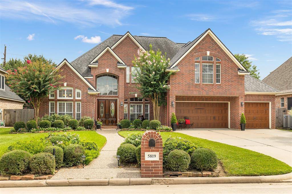 This gorgeous home features an all brick exterior, beautiful landscaping, and fantastic curb appeal!