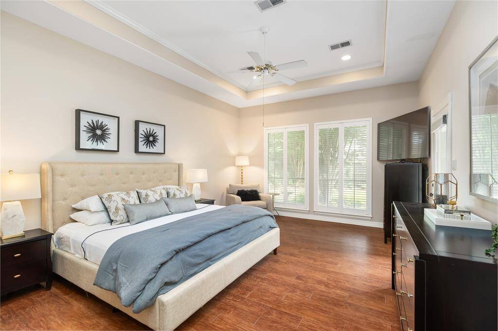 The Primary Bedroom will be your private retreat, with 11-ft coffered ceiling, and plenty of space for your entire bedroom furniture set.