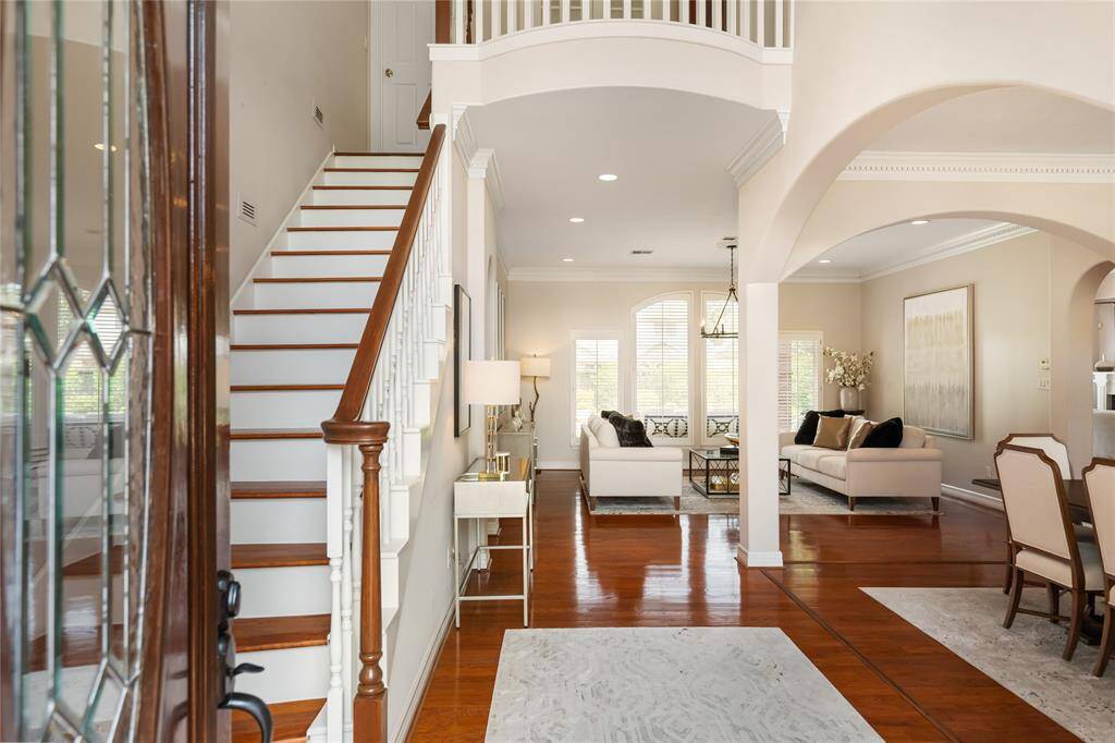 When you welcome guests into your gorgeous new home they'll immediately see the gleaming hardwood floors and arched doorways leading to the Formal Living and Dining Rooms.