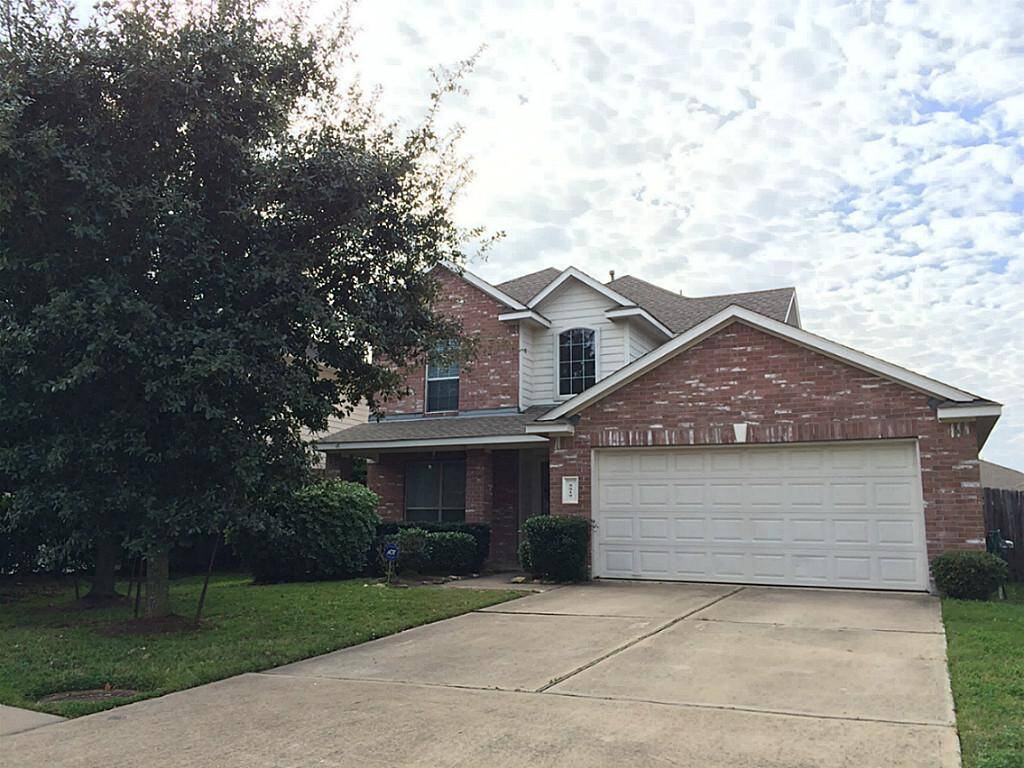 Welcome to 5819 Laramie River! Spacious driveway is covered by mature trees