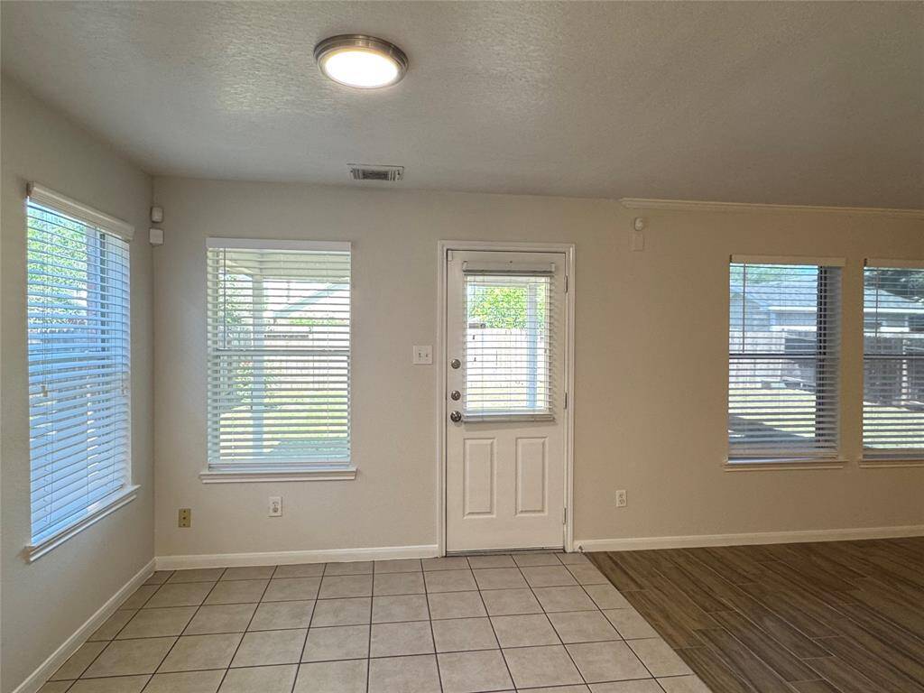 Breakfast area with new light fixtures and plenty of natural light