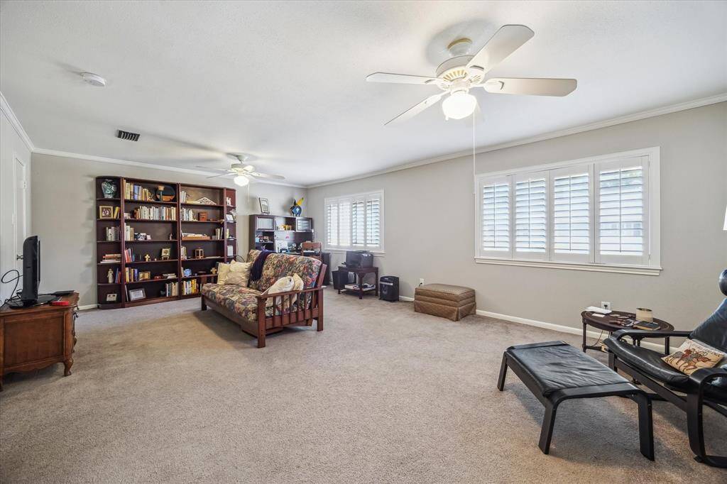The utility room off the kitchen has ample storage.