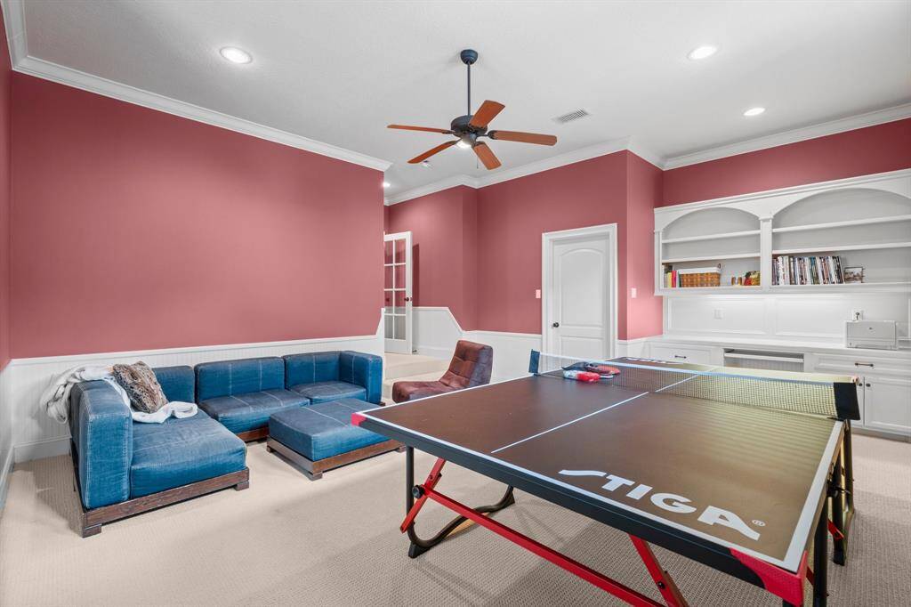 Large game room is perfect for family fun and entertainment.