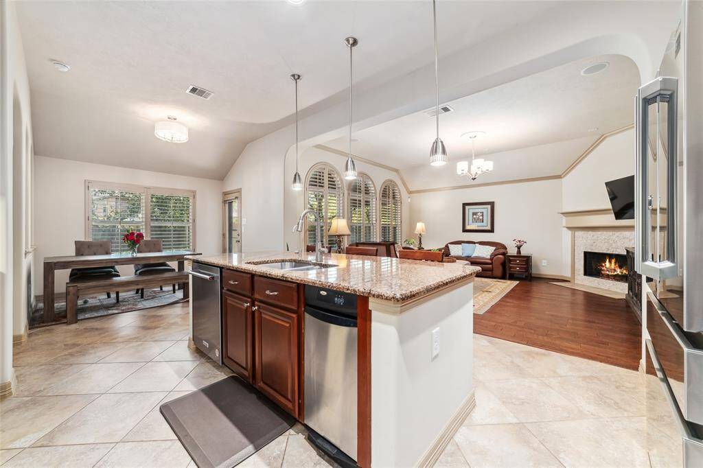 Ideal for entertaining, this open floor plan seamlessly connects living, dining, and kitchen spaces.