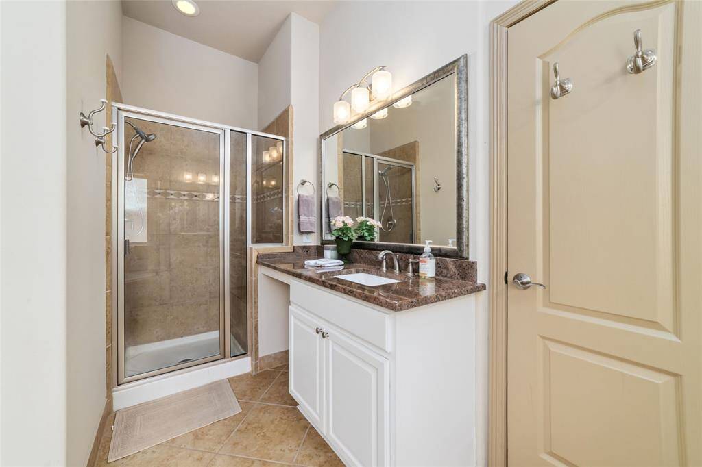 Spacious shower and expansive primary closet for ultimate comfort.