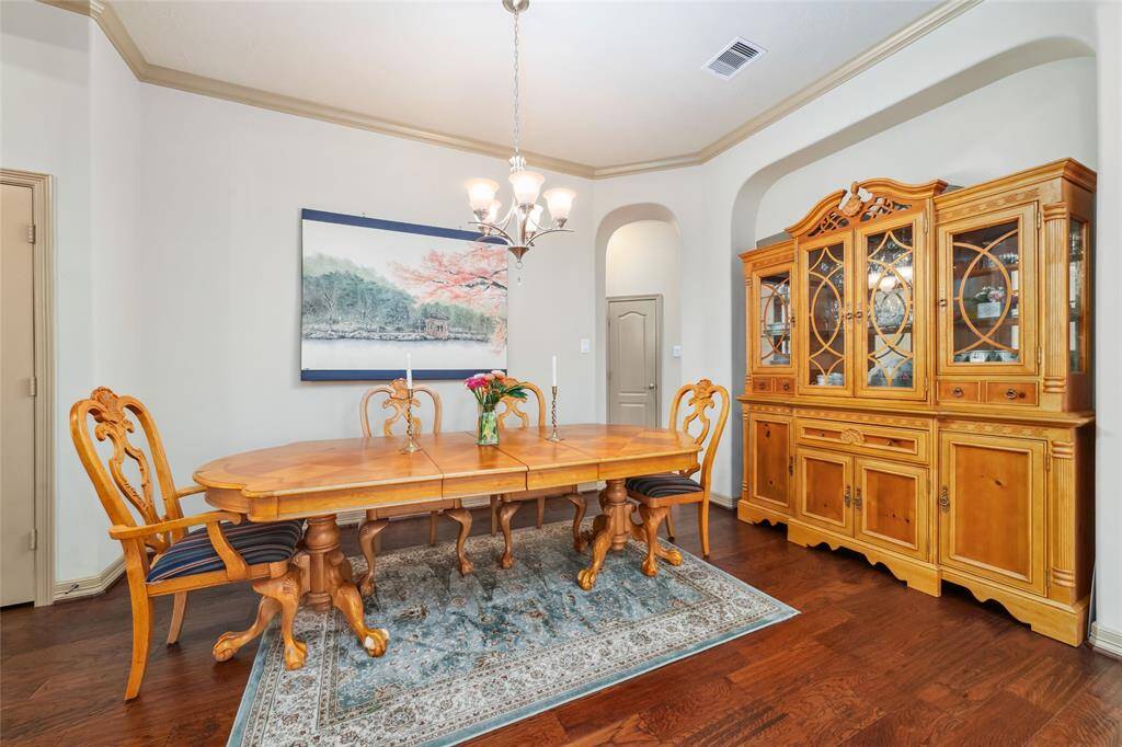 Spacious dining area perfect for entertaining or easily converted into a game room with a pool table.