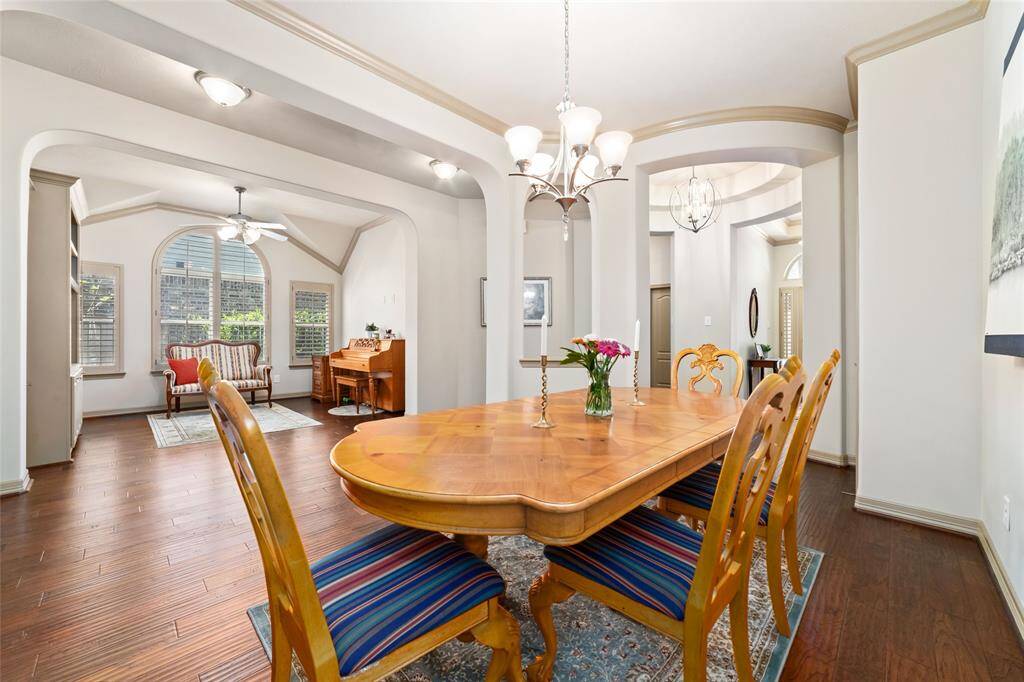 View of entry, secondary bedrooms, flex space and dining room. This home has so many storage spaces as well.