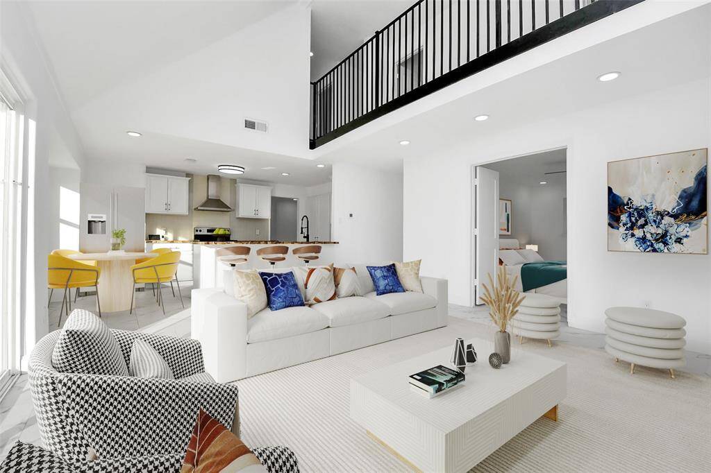 closer view of the fireplace reveals its integration with the open-concept layout, offering a perfect flow toward the kitchen area—an ideal setup for entertaining guests. The possibilities in this space are endless. (Virtually Staged)