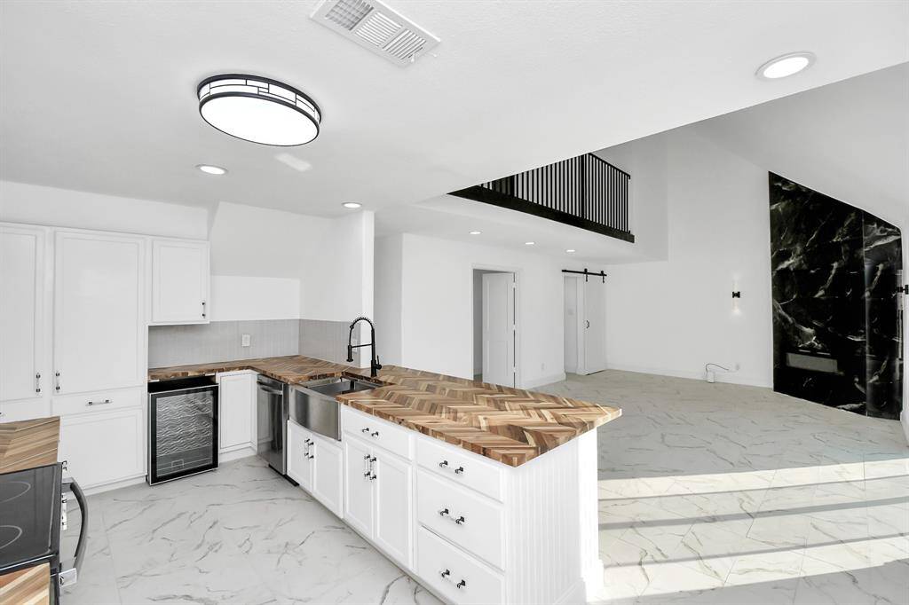 The kitchen is beautifully equipped with sleek modern finishes, yet fully prepared to meet the needs of any chef.