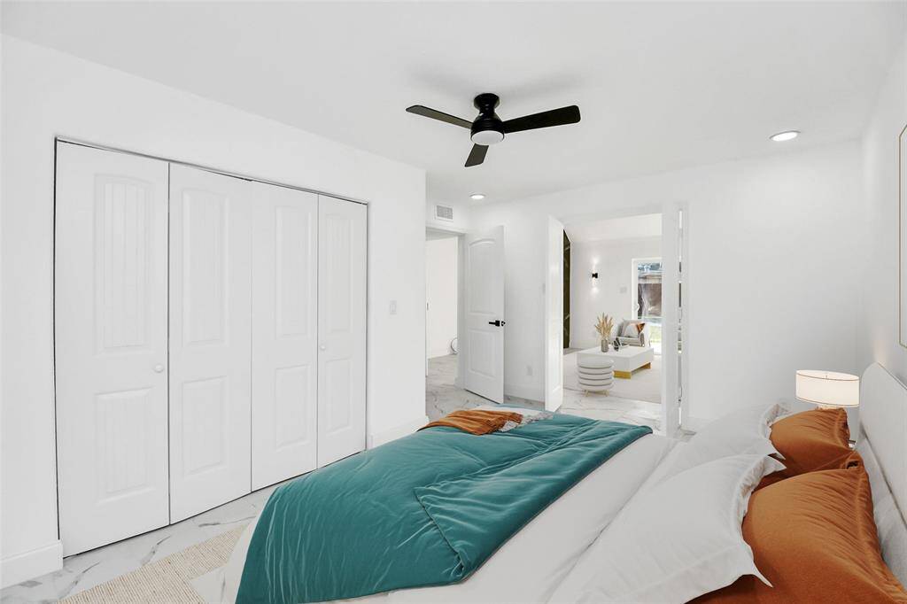 This versatile downstairs room can function as a primary bedroom or be transformed into a flexible space, ideal for a media room or office. (Virtually staged