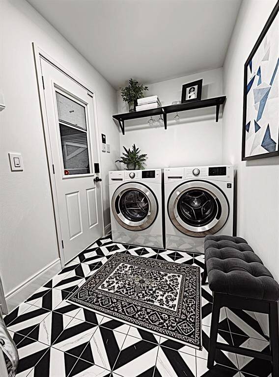 This downstairs laundry room is a delight! What a beautiful workspace. (Virtually Staged)