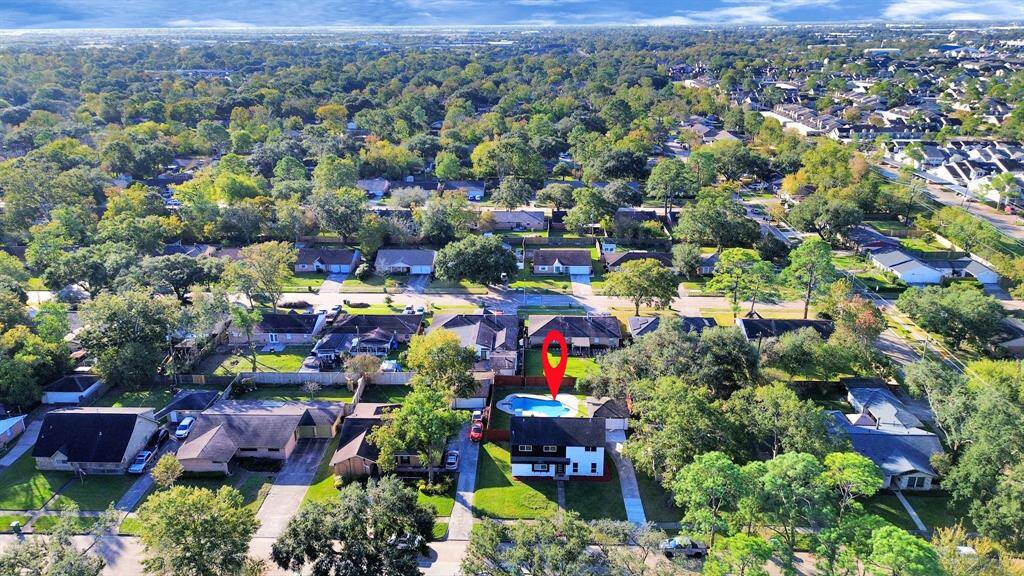 Nestled in a well-established community, this home is surrounded by mature trees and abundant character.