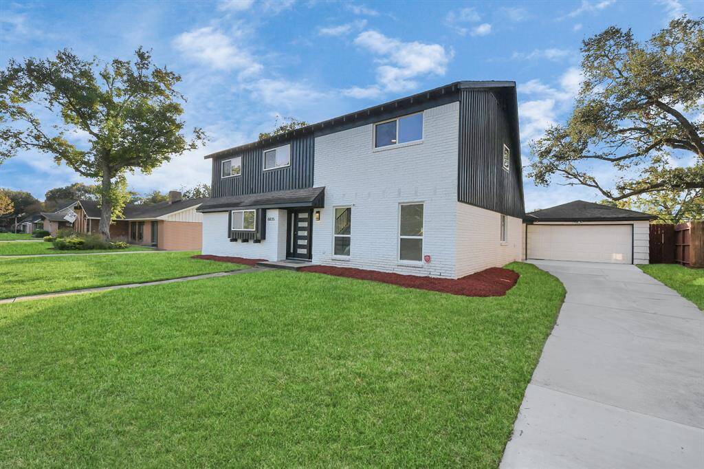 A long driveway extends to a detached garage, offering ample space for activities like basketball or hopscotch, adding to the home's family-friendly appeal. Welcome Home!