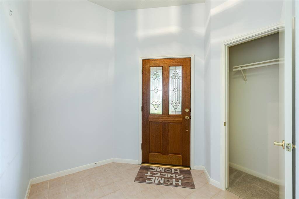 Foyer with coat closet.