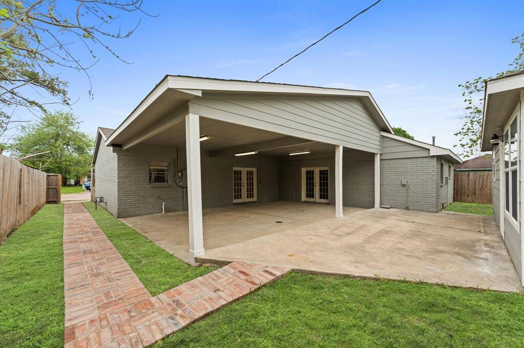 Spacious covered patio ad private entrance to the back apartment