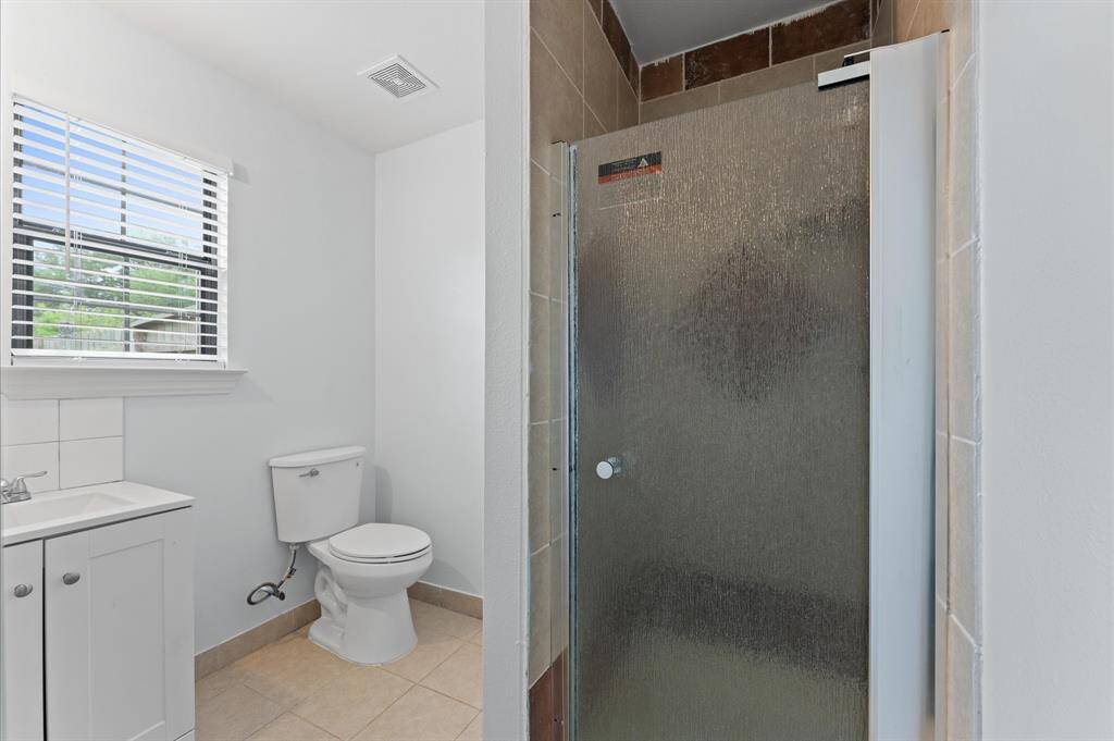 Full bathroom with standalone shower.