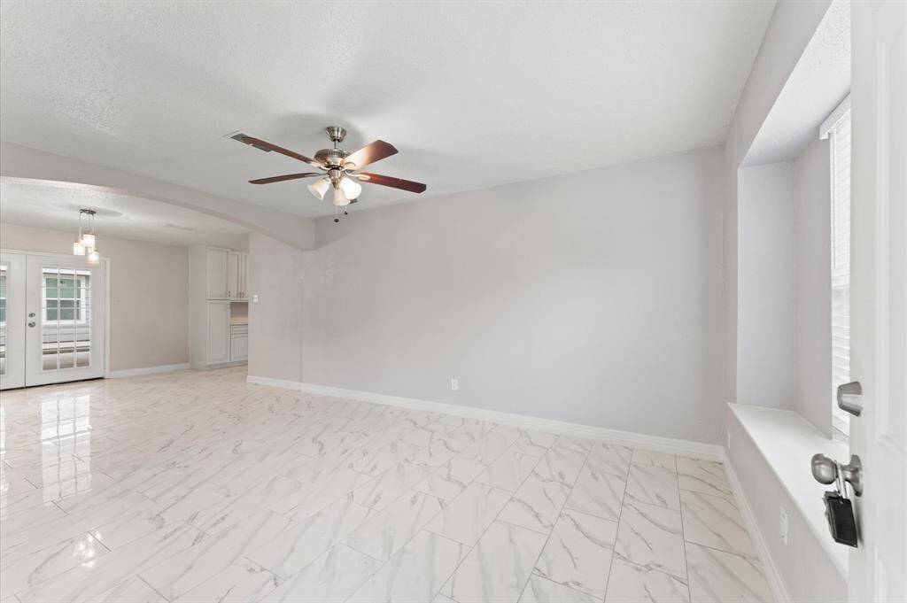 Living area seamlessly flows into dining space.