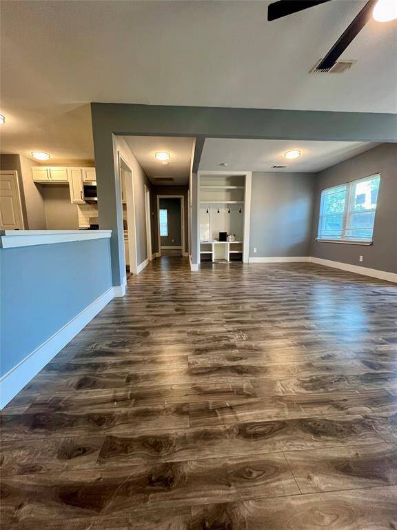 View a family room leading to secondary bedrooms
