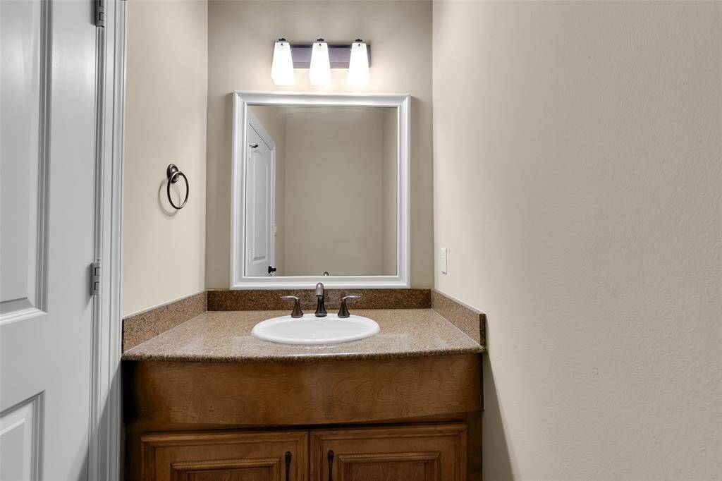 Powder bath next to office off kitchen